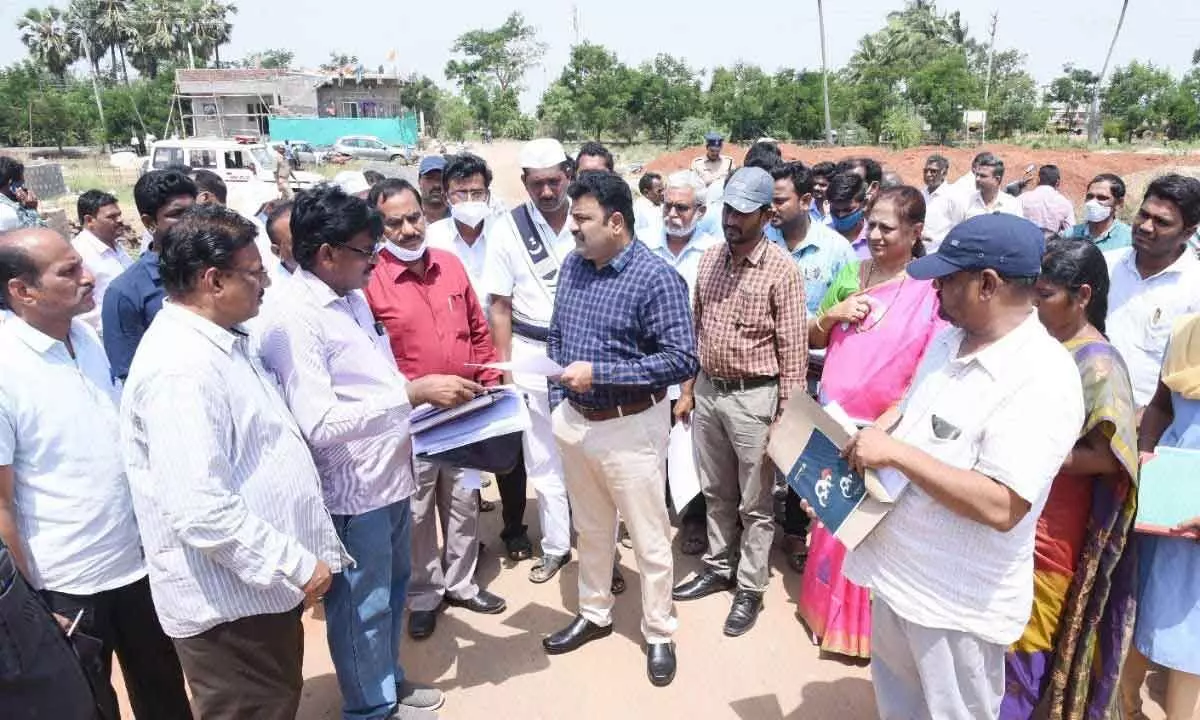 Krishna District Collector Ranjit Basha speaking to the officials and villagers at Challapalli village on Tuesday