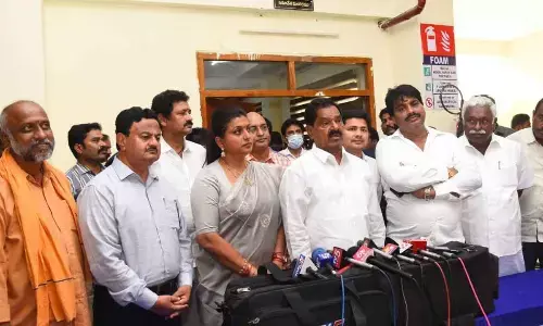 DyCM K Narayana Swamy and minister R K Roja speaking to the media in Tirupati on Tuesday. Collector K Venkata Ramana Reddy, ZP chairman G Srinivasulu, MP  Dr M Gurumoorthy, MLA B Madhusudhan Reddy and others are also seen.