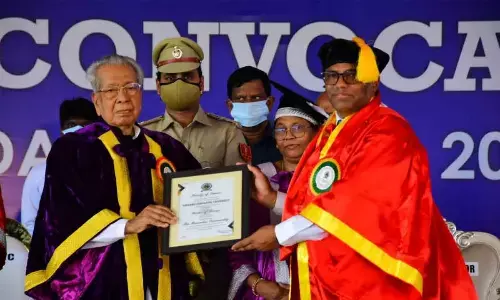 Governor Biswa Bhusan Harichandan presenting honorary doctorate to Sri City founder MD Ravindra Sannareddy in Nellore on Tuesday