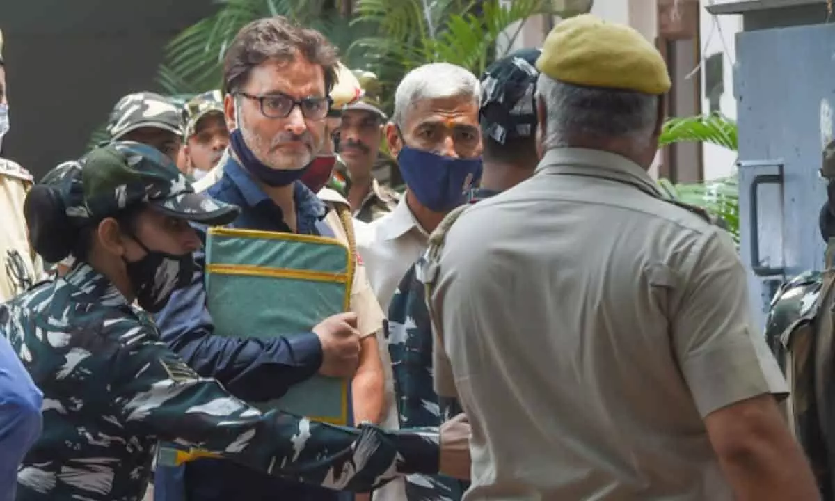 Kashmiri separatist leader Yasin Malik being produced at Patiala House court, in New Delhi on Wednesday