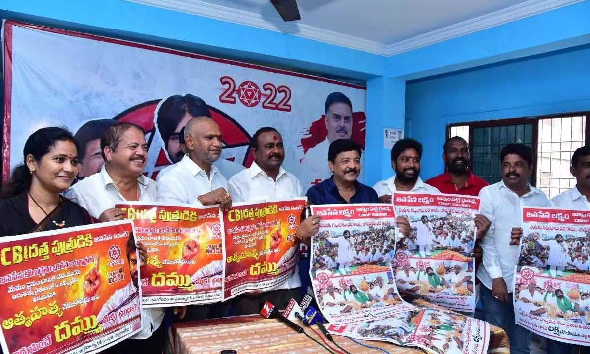 Jana Sena Party leaders displaying party campaign posters at press conference in Rajahmundry on Thursday