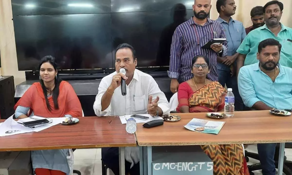 MLA A Srinivasulu speaking at a meet held in Chittoor on Thursday. Commissioner Aruna and Mayor Amuda are also seen.