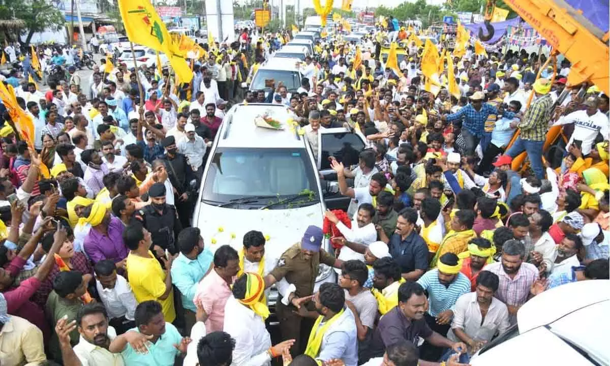 TDP national president N Chandrababu Naidu greeting party activists during a massive rally from the party State office in Mangalagiri to Ongole on Thursday