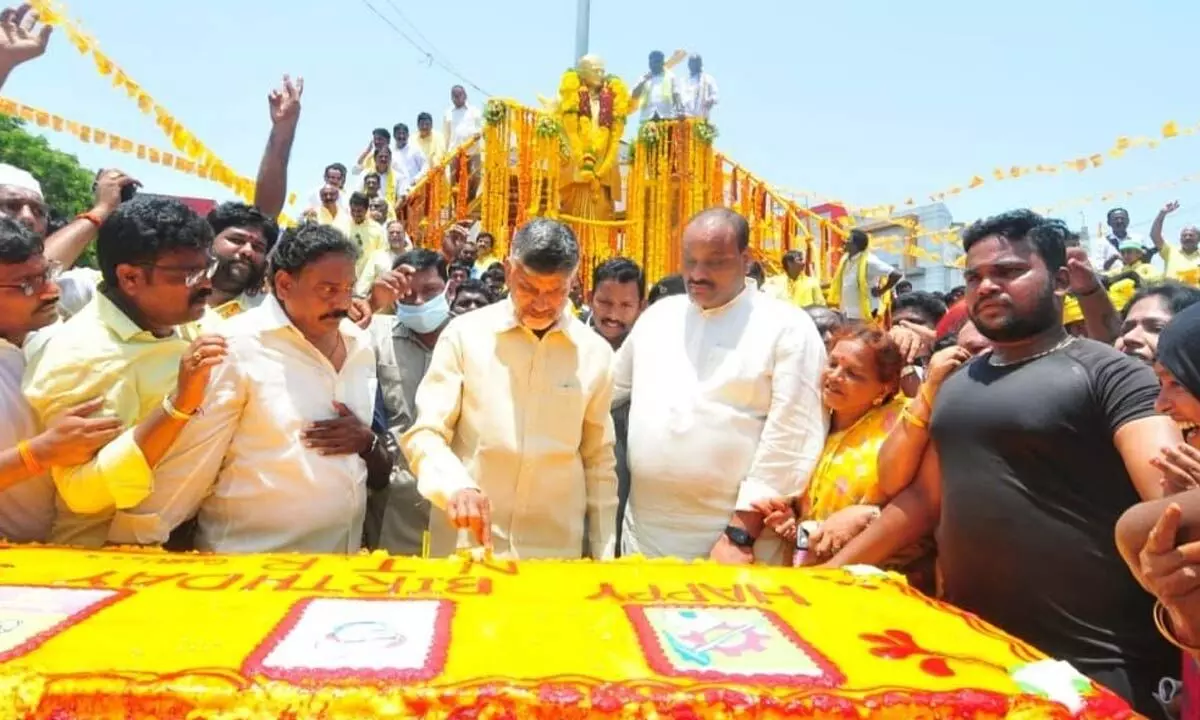 TDP president N Chandrababu Naidu along with party senior leaders cuts a cake on the occasion of 99th birth anniversary of party founder NT Rama Rao  in Ongole  on Saturday