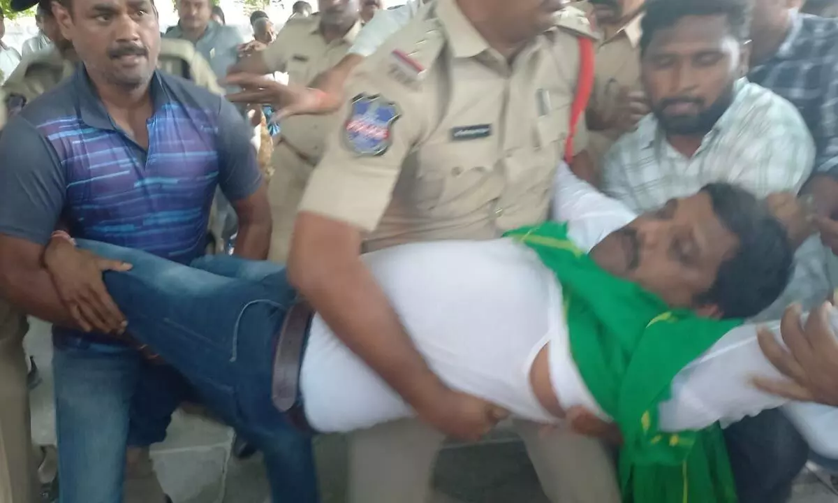 Police forcibly taking away Teenmar Mallanna from Pochamma Temple at Arepally village in Warangal district on Saturday