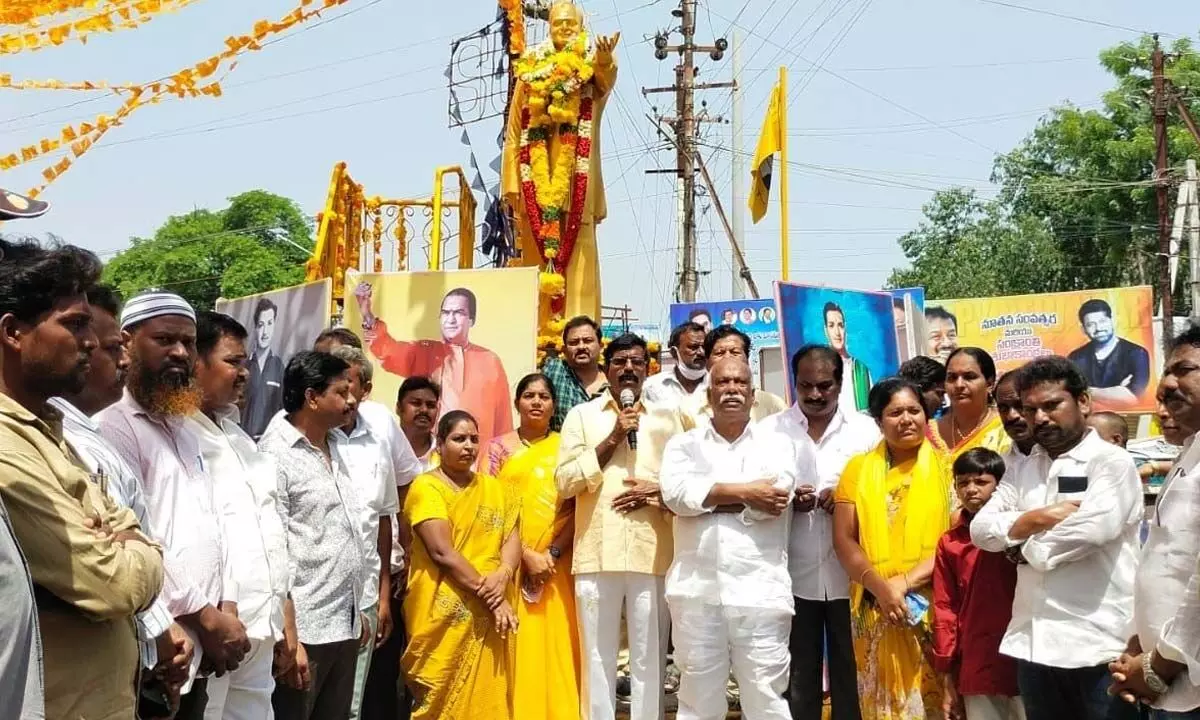 TDP leaders garland the statue of NTR in Jaggaiahpet, NTR district on Saturday