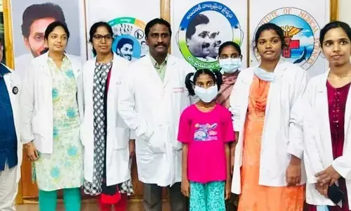 A team of doctors with a 13-year-old girl, who was treated at VIMS hospital in Visakhapatnam on Saturday