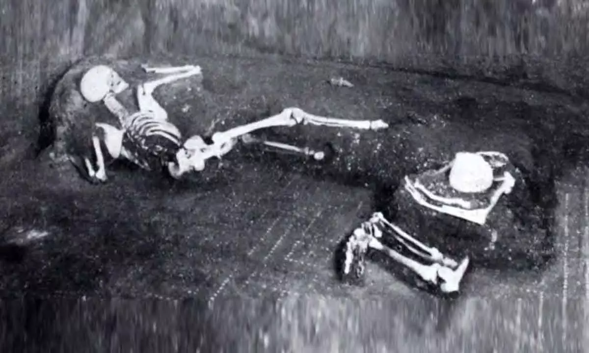 The two individuals, laying as they died.
