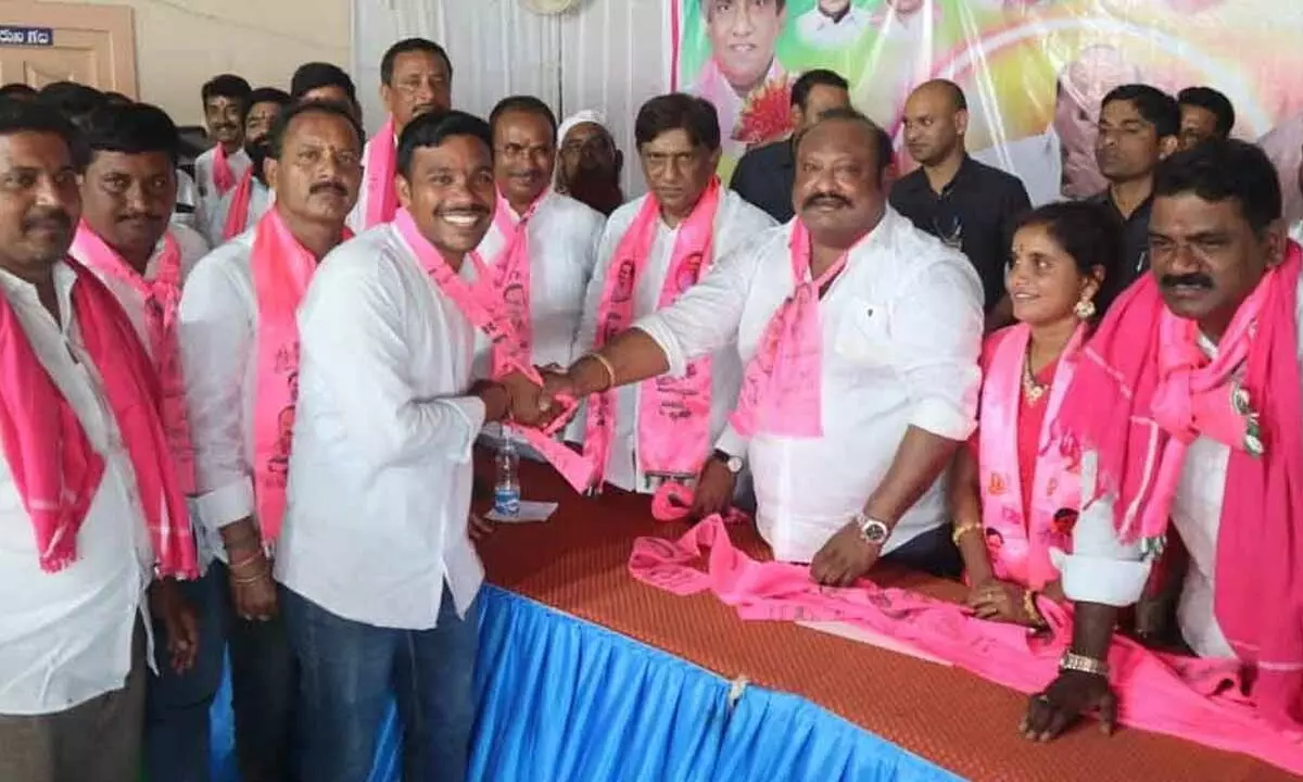 BC welfare minister G Kamalakar and TS planning board vice-chairman B Vinod Kumar inviting other political parteis leader into TRS party in Asifnagar, Kothapalli mandal on Sunday