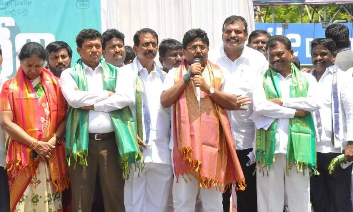 Minister for Municipal Administration and Urban Development Audimulapu Suresh addressing a public meeting during their bus yatra in Kurnool on Sunday.  Ministers S Appala Raju, Botcha Satyanarayana and others are seen.