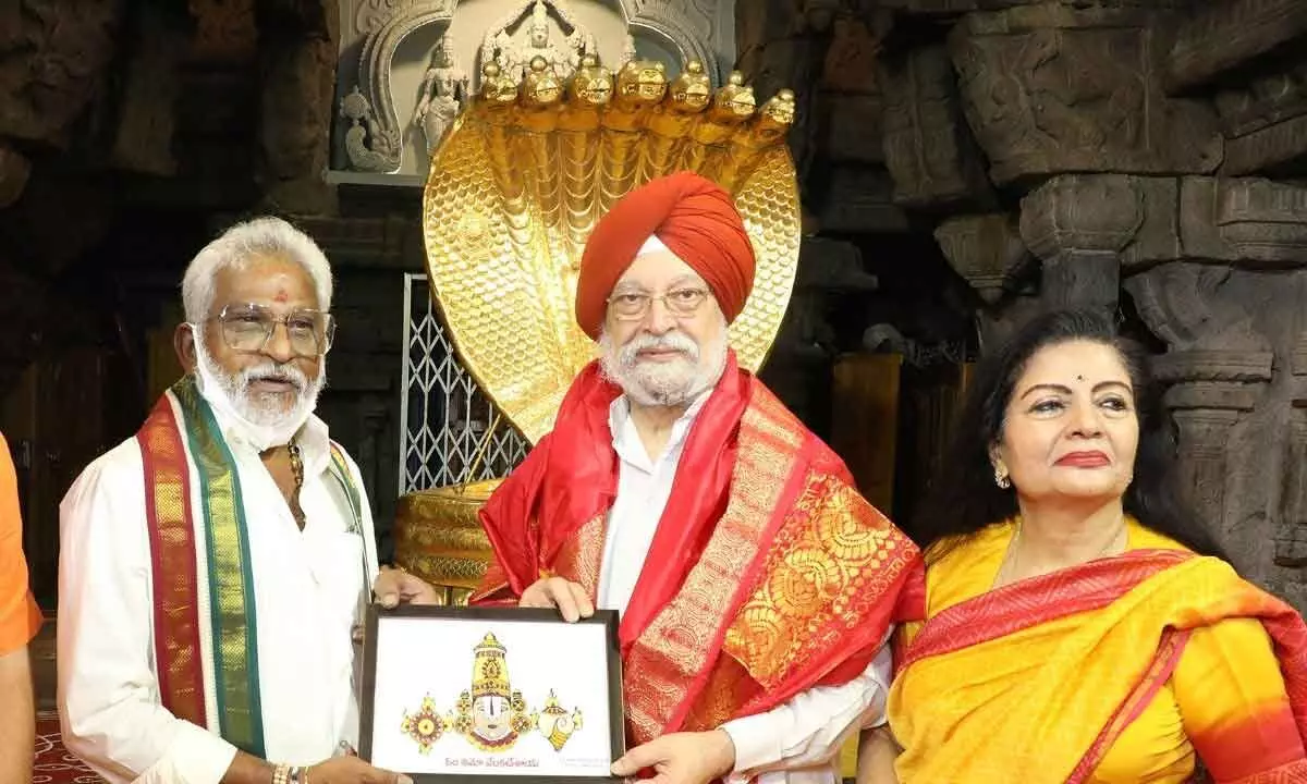 TTD Chairman Y V Subba Reddy presenting a portrait of Lord Venkateswara to Union Minister Hardeep Singh Puri at Tirumala on Sunday