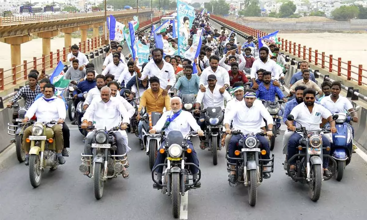 YSRCP national general secretary V Vijaysai Reddy leading a bike rally to mark the completion of three years of governance by Chief Minister YS Jagan Mohan Reddy, in Vijayawada on Monday	Photo: Ch Venkata Mastan