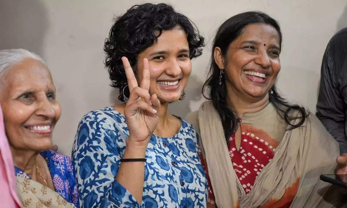 St Stephens alumnus Shruti Sharma, who topped the Civil Services 2021 Exam and secured AIR 1, with her family members at her residence, in New Delhi on Monday