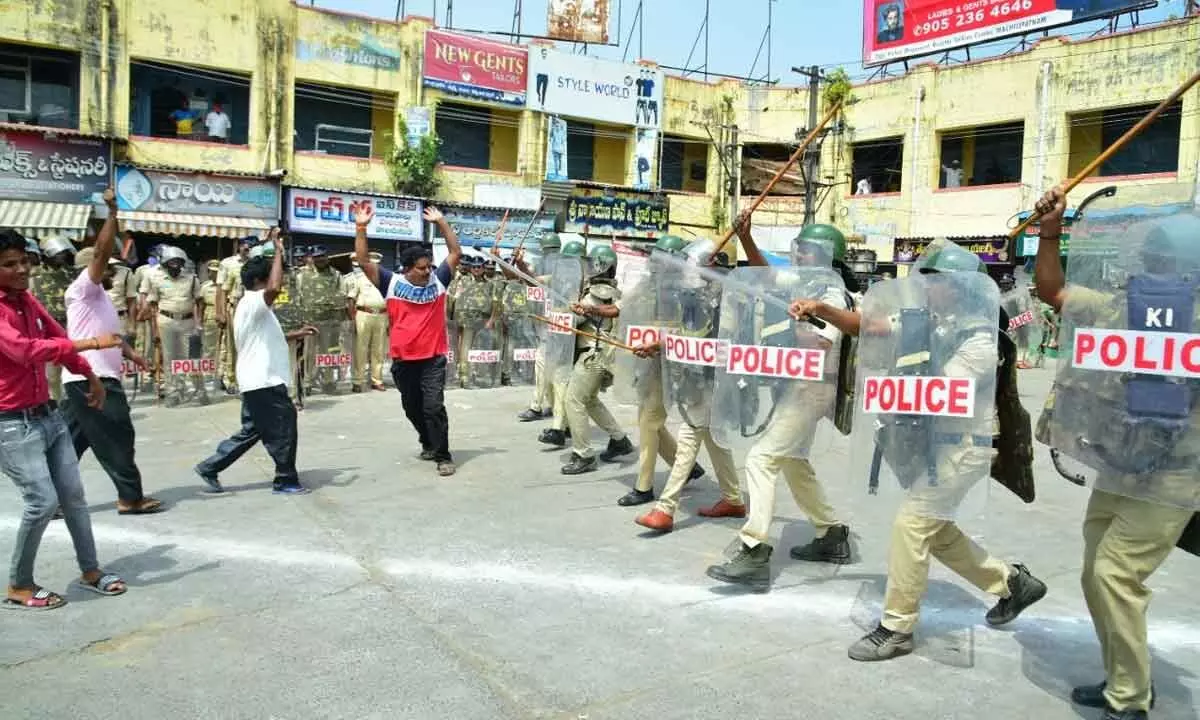 Police personnel conducting mock drill at district headquarters in Machilipatnam on Monday