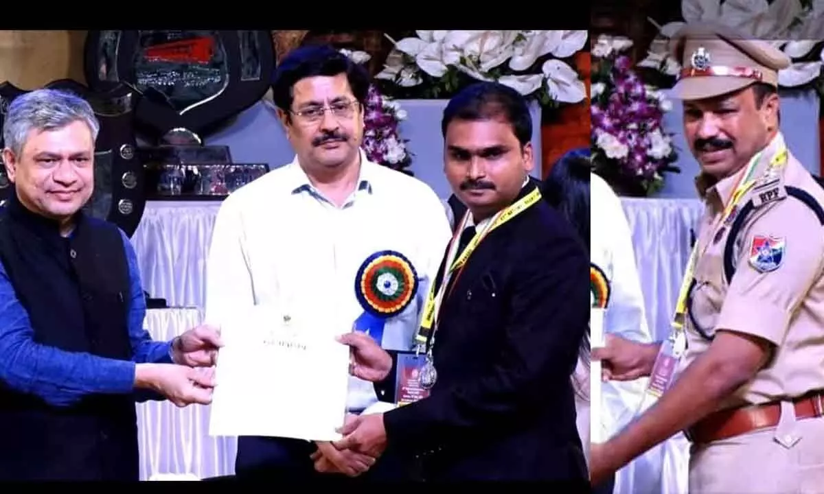 The Union Minister presenting the award to Senior Divisional Telecom Engineer R Viswanath Reddy ; RPF Inspector TS Chandra Sekhar Reddy