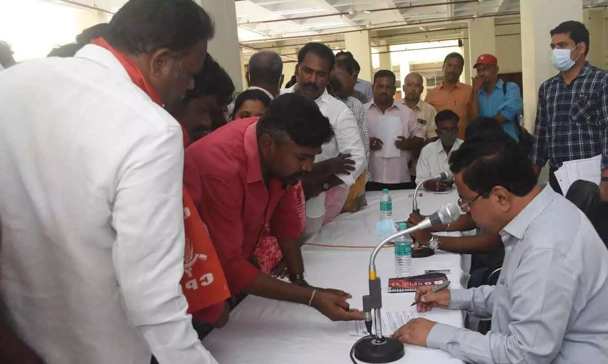 Street Vendors Workers Association state president Siva Kuamr submitting a representation to the Collector on their demands in Tirupati on Monday.
