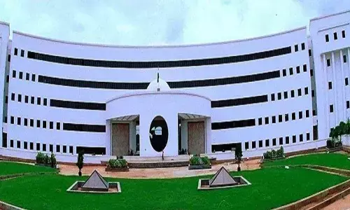 Bus Bhavan lit up to raise awareness on Huntington disease