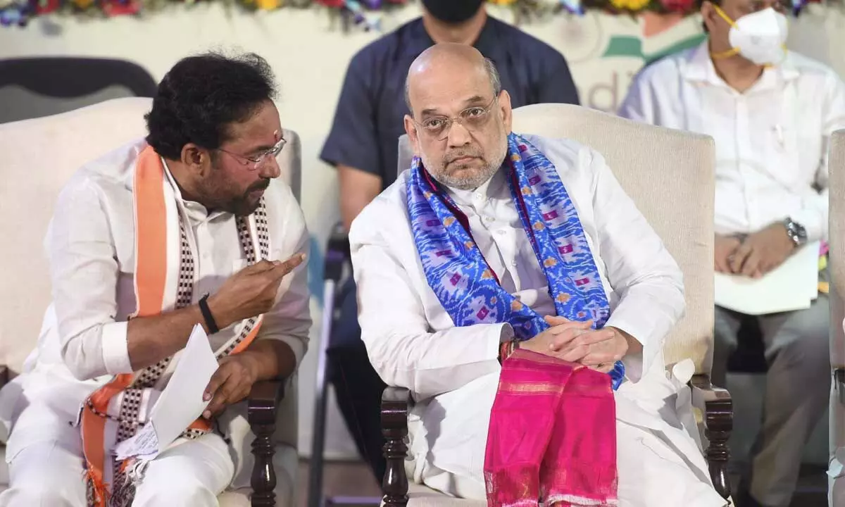 Union Home Minister Amit Shah interacts with Union Minister for Culture G Kishan Reddy during an event organised to celebrate the Telangana Formation Day, at Dr Ambedkar International Centre in New Delhi on Thursday
