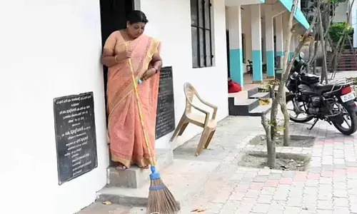 K R Usha Kumari sweeping the PSNM Government Higher Secondary School premises at Peroorkada in Thiruvananthapuram | Vincent Pulickal
