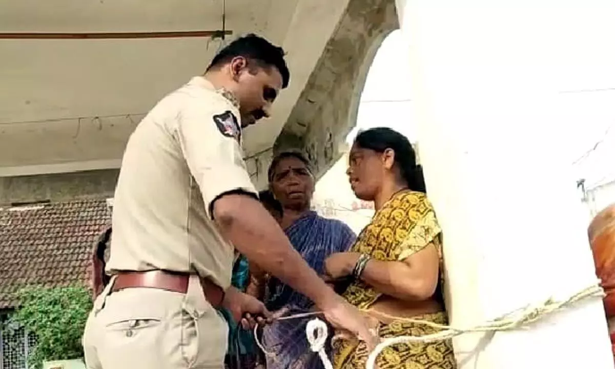 Locals tie woman to a temple pillar over chit fund fraud
