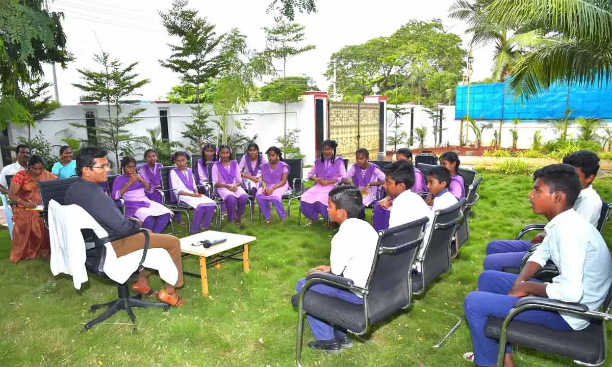 Collector AS Dinesh Kumar interacting with students at his office