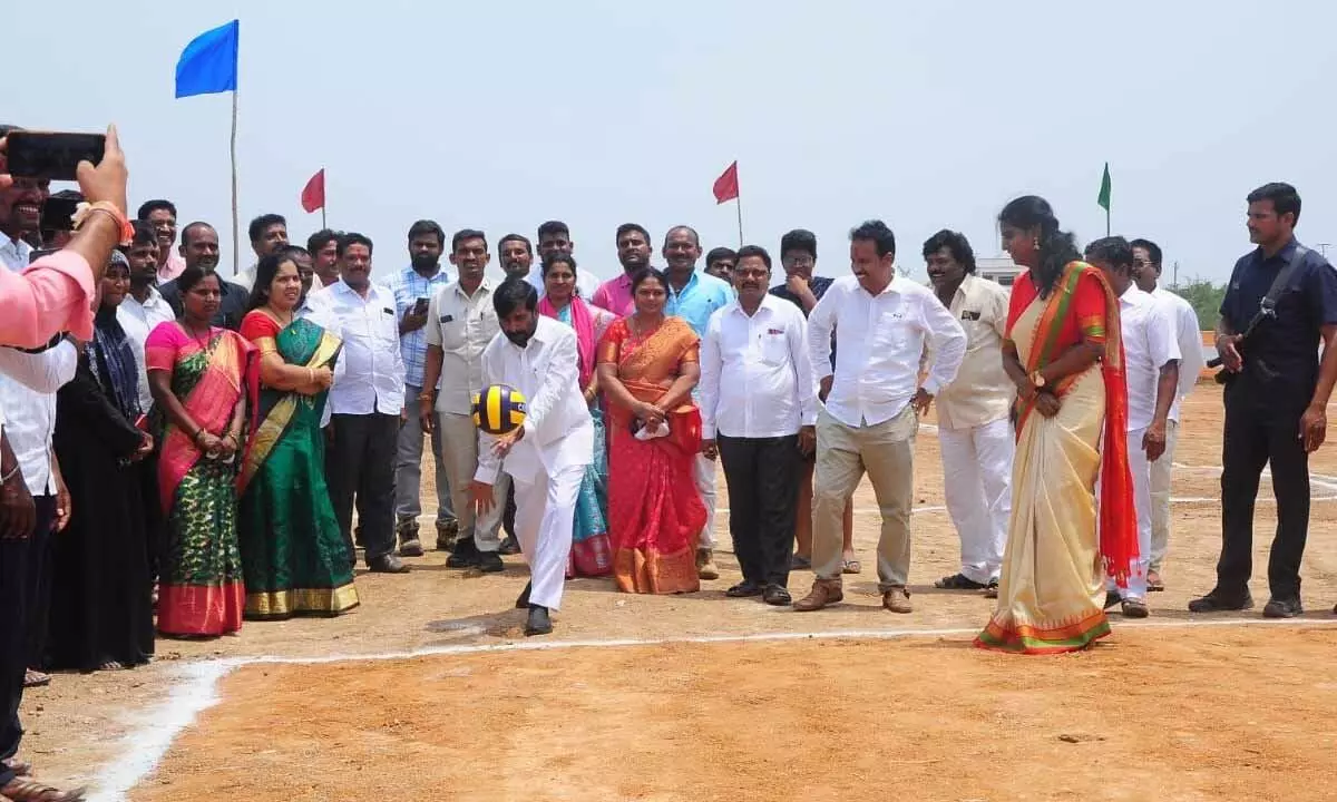 Minister Jagadish Reddy playing volleyball after inaugurating a playground in Neredu Cherla on Saturday