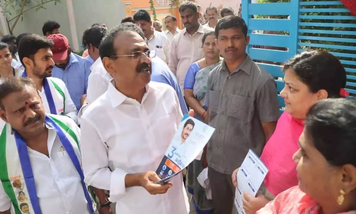 MLA Bhumana Karunakar Reddy briefing the residents of Akkarampalli about the successful implementation of welfare schemes, in Tirupati on Sunday.