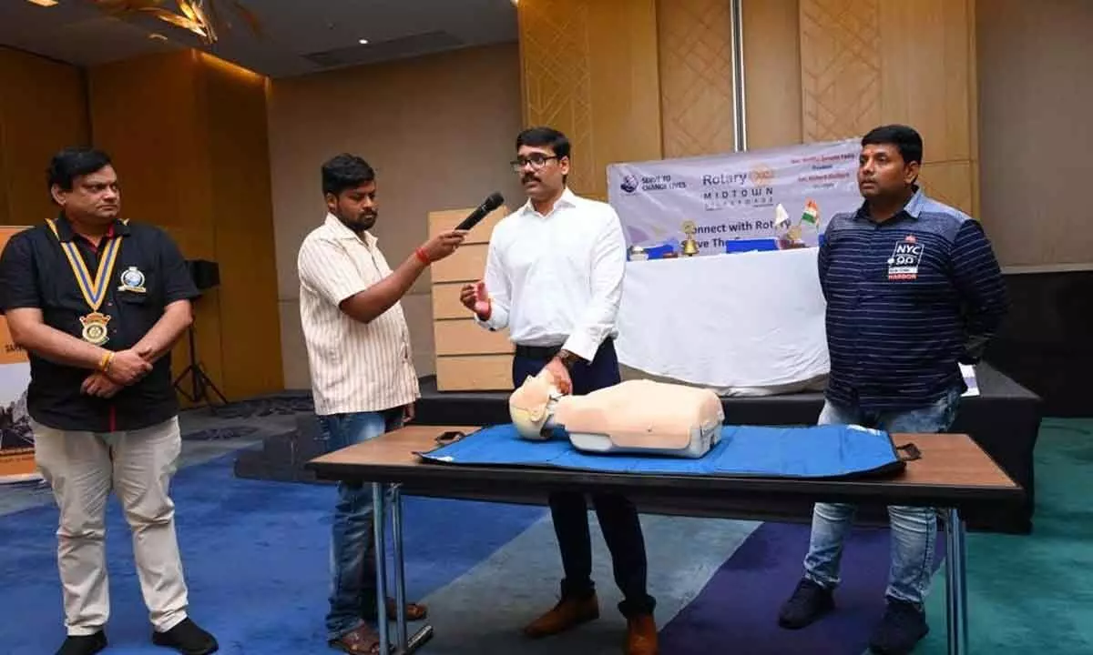 Dr Varun explaining Cardiopulmonary Resuscitation technique at an awareness programme in Vijayawada on Sunday