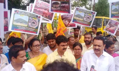 TDP leader and former minister Bandaru Satyanarayana Murthy speaking at a dharna held in Visakhapatnam on Sunday