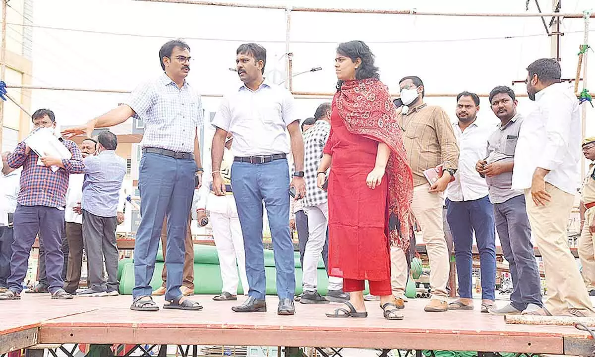 District collector M Venugopala Reddy and  GMC commissioner Kirthi Chekuri inspecting the dais at the Guntur Mirchi Yard on Monday for CMs public meeting on Tuesday