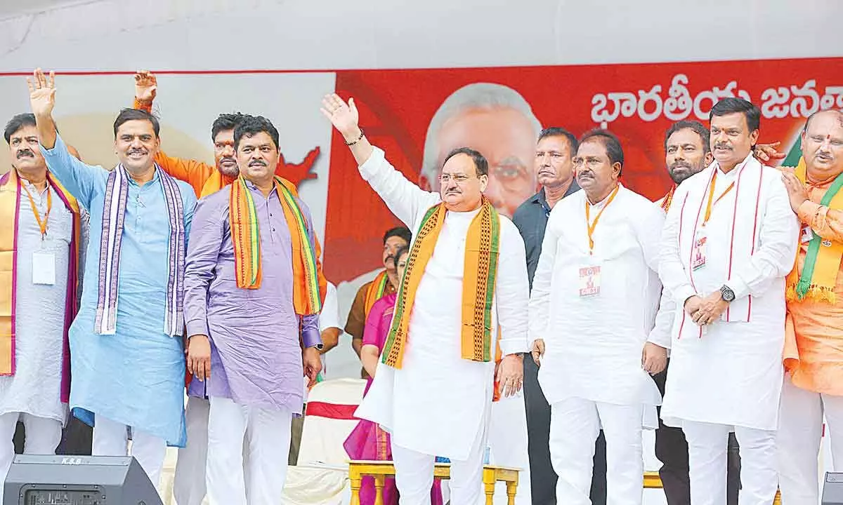BJP national president J P Nadda and other leaders greet people at the Godavari Garjana public meeting in Rajamahendravaram on Teusday