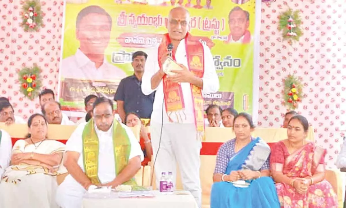Health Minister T Harish Rao addressing a gathering at Pandilla village in Husnabad on Tuesday