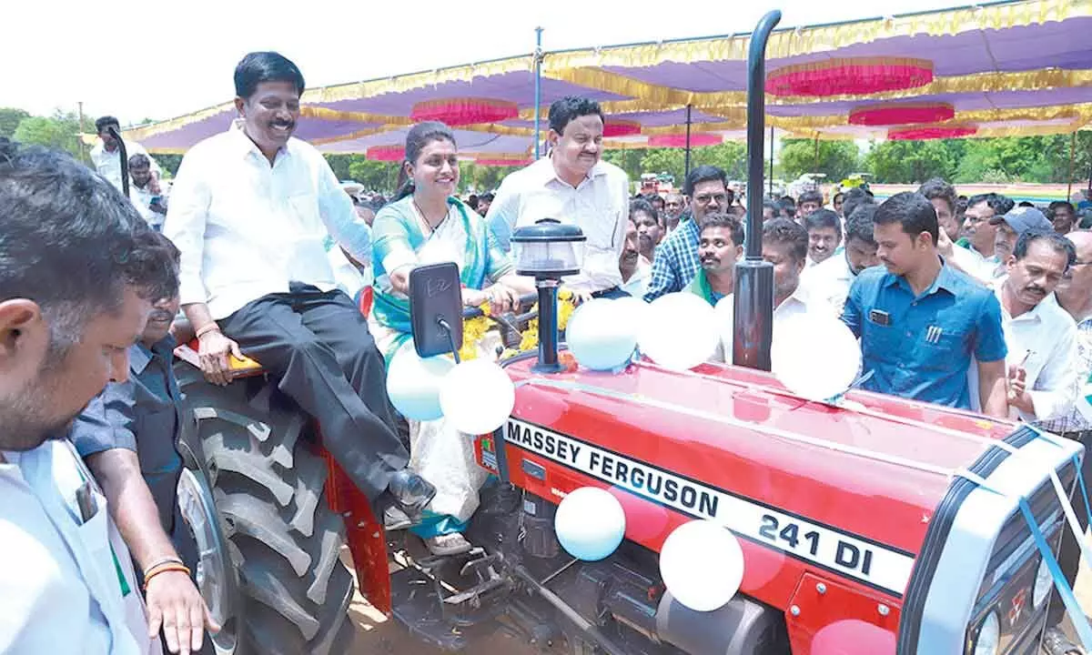 Minister RK Roja inaugurating a tractor at SVU Stadium in Tirupati during the YSR Yantra Seva Scheme mega mela on Tuesday. Sullurpeta MLA K Sanjeevaiah and Tirupati Collector K Venkata Ramana Reddy are also seen.