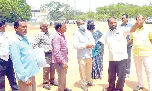 MLA Bhupal Reddy along with principal Chandra Shekar explaining about the works of building of NG College to govt advisor Suddala Sudhakar Teja during his visit to Nalgonda on Tuesday