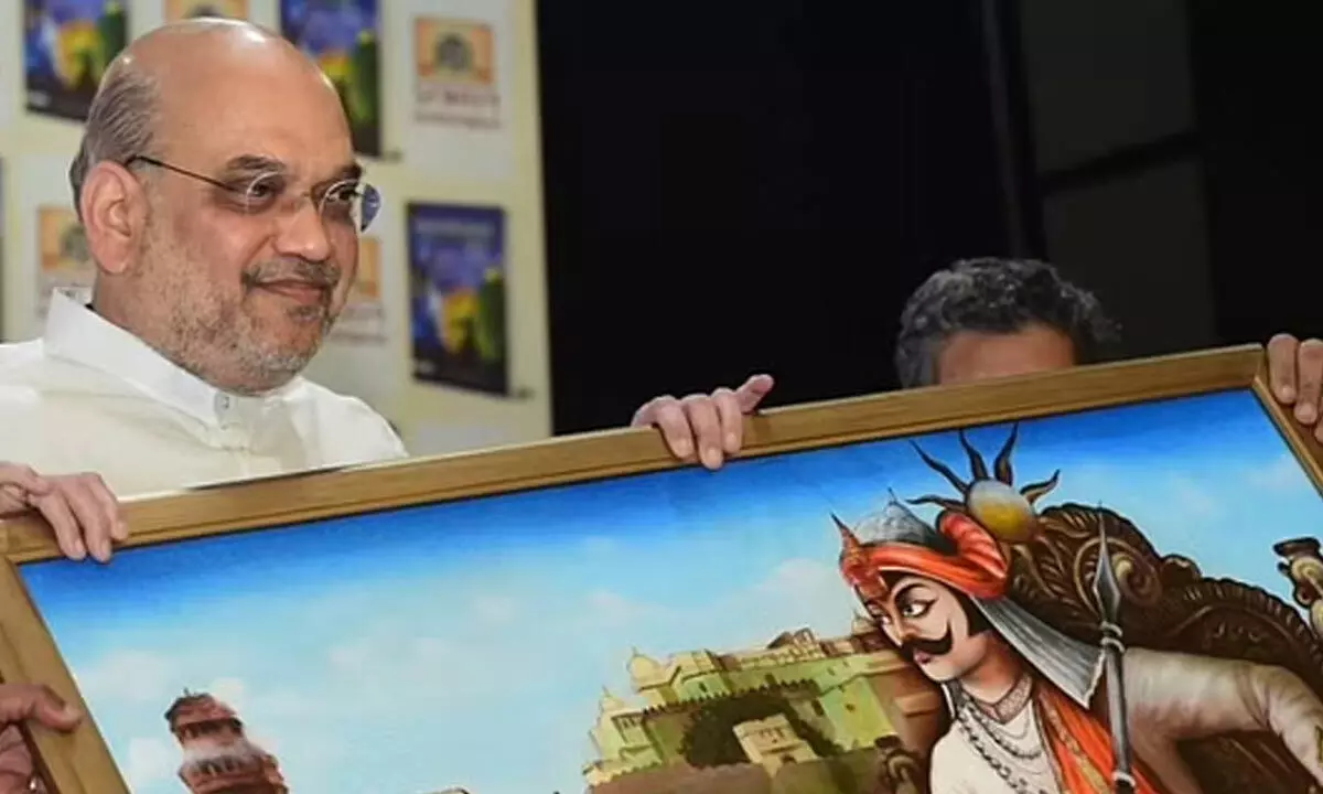 Union Home Minister Amit Shah receives a memento during the launch of a book Maharaja: Sahastra Varshon Ka Dharmyudh in New Delhi. (Photo | PTI)