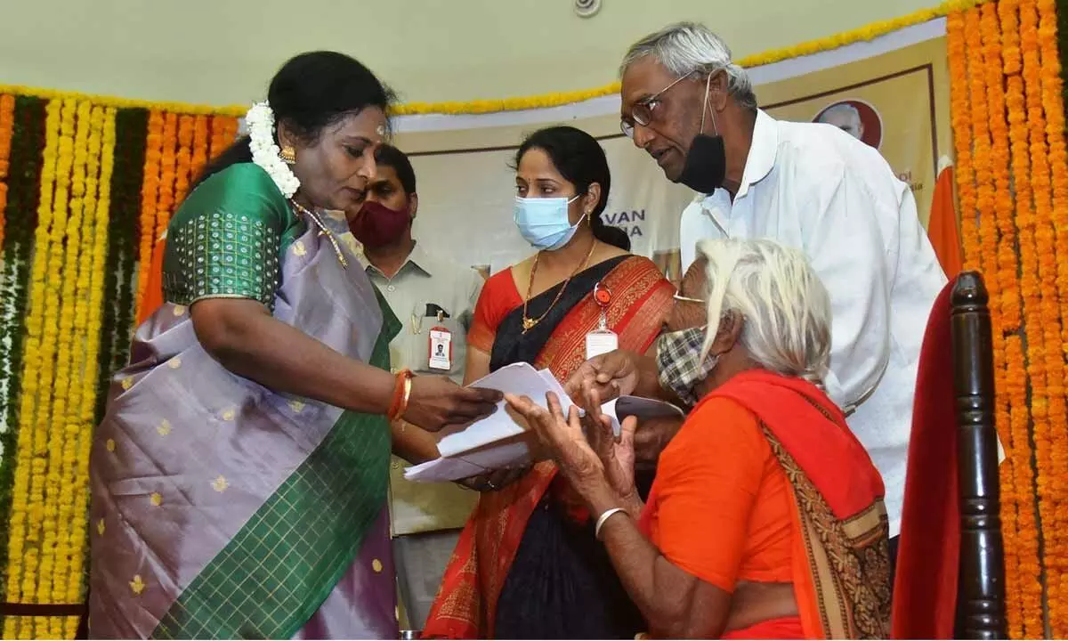 Governor Tamilisai Soundararajan receiving a memorandum at ‘mahila darbar’ at Raj Bhavan on Friday. Photo: Adula Krishna
