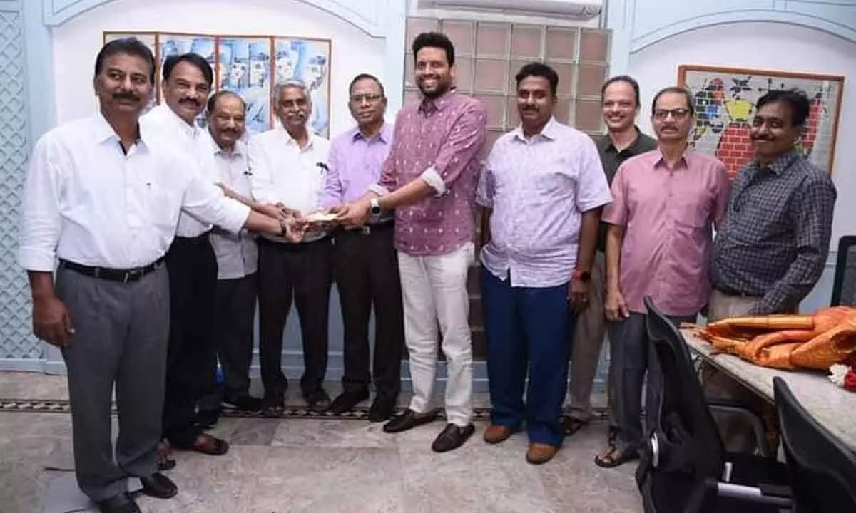 Junior chairman of TG Group of Companies TG Bharat handing over a cheque for  Rs 26 lakh, out of Rs 50 lakh donation announced for construction of IMA building, to IMA members in Kurnool on Saturday