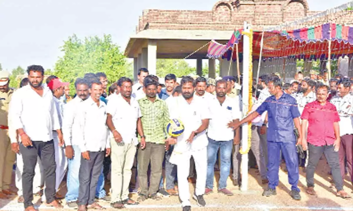 Minister Srinivas Goud playing volleyball after inaugurating sports complex in Mahabubnagar district on Saturday