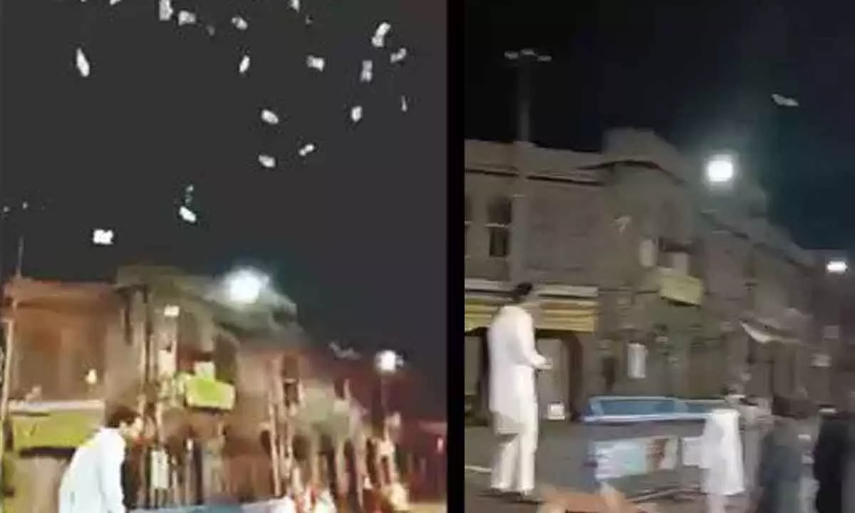 Currency notes tossed in air at Charminar