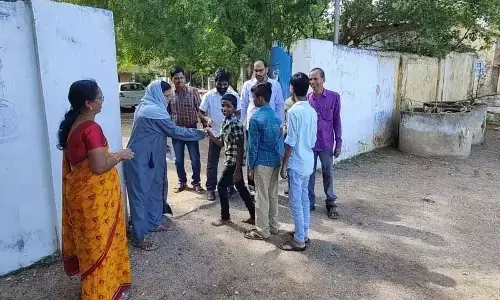 Teachers greet students with flowers as schools reopen