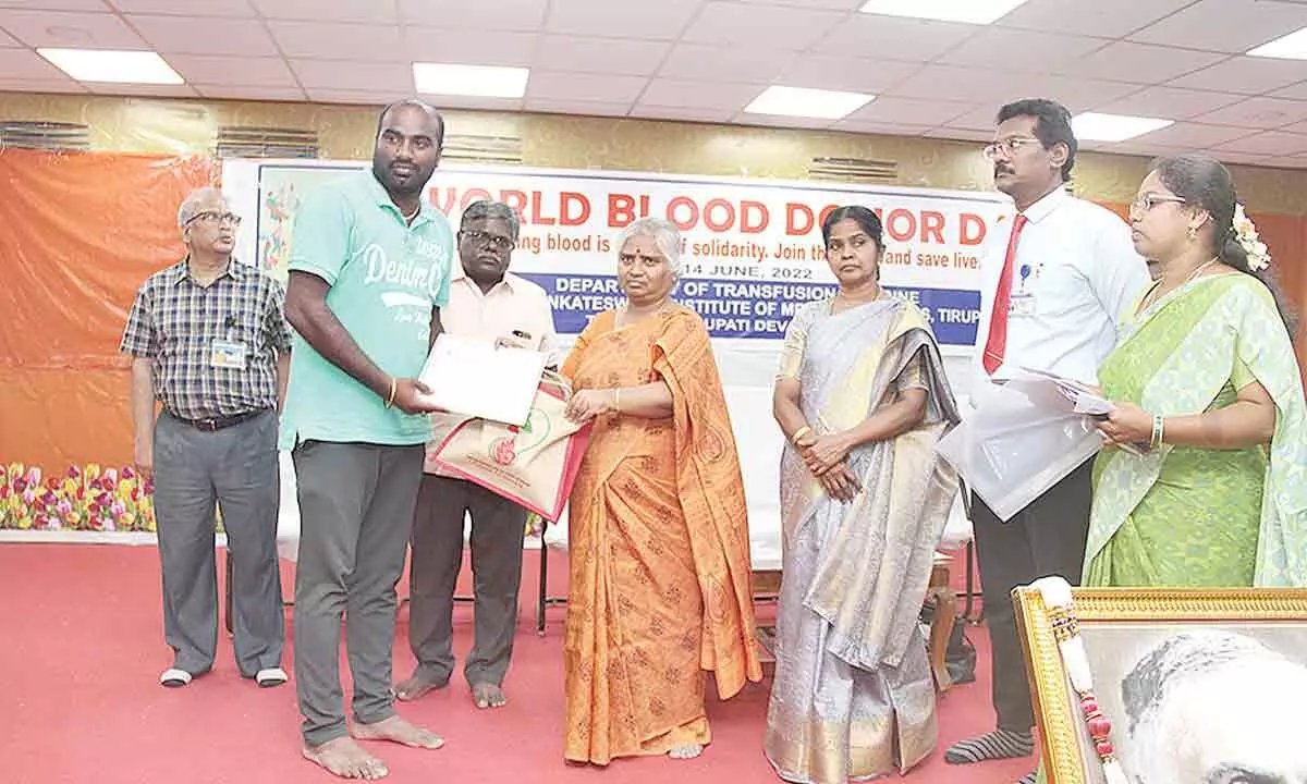 SVIMS Director Dr B Vengamma presenting certificate to a blood donor in Tirupati on Tuesday. Registrar Dr KV Sridhar Babu, Additional DM&HO Dr C Aruna Sulochana Devi and others are seen.