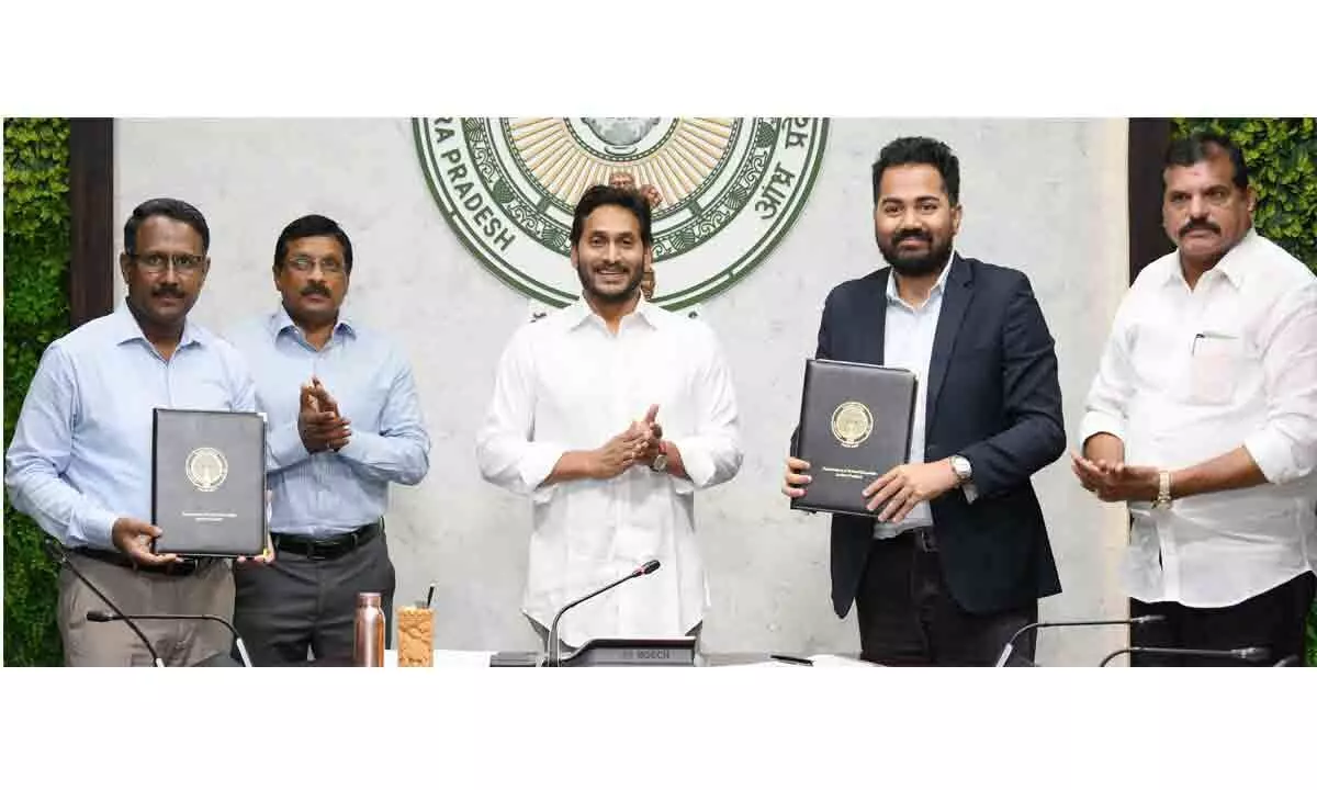 School Education Commissioner S Suresh Kumar and Byjus vice-president (public policy) Sushmit Sarkar exchange copies of MoU in the presence of Chief Minister Y S Jagan Mohan Reddy in Tadepalli on Thursday