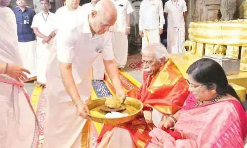 TTD EO A V Dharma Reddy offering Srivari Prasadam to Haryana Governor Bandaru Dattatreya at Tirumala on Saturday