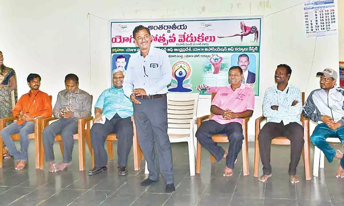 District Sports Authority Chief Executive Officer PV Ramana addressing the 8th International Yoga Day inaugural ceremony at outdoor stadium in Kurnool on Sunday