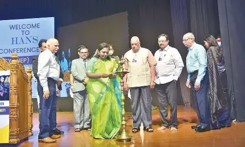 Telangana Governor Dr Tamilisai Soundararajan lighting the lamp marking the inauguration of the second-day of Hans India conference on National Education Policy at Shilpakala Vedika in Hyderabad on Sunday. Photo: Adula Krishna