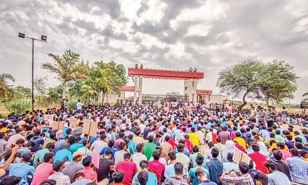 Over 7,000 students of IIIT Basara continuing their agitation for basic amenities on the campus for the 7th day on Monday.  Photo courtesy: Sri Krishna