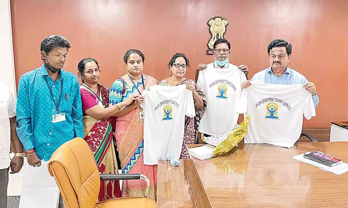 District Collector K Venkata Ramana Reddy releasing the International Yoga Day T-shirts in Tirupati on Monday