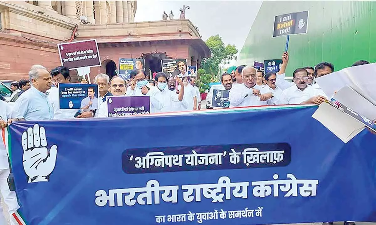 Congress leaders march towards Presidents House from Parliament House against the Centres Agnipath scheme, in New Delhi on  Monday