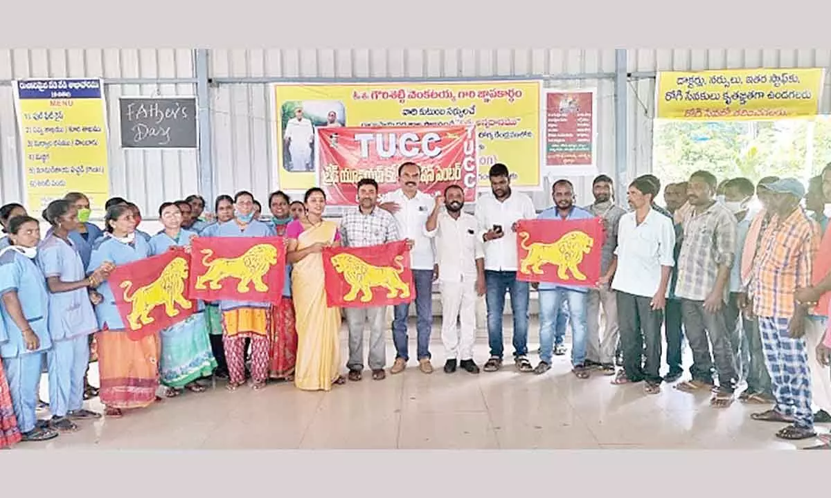 TUCC leaders and workers staging a dharna in Karimnagar on Monday