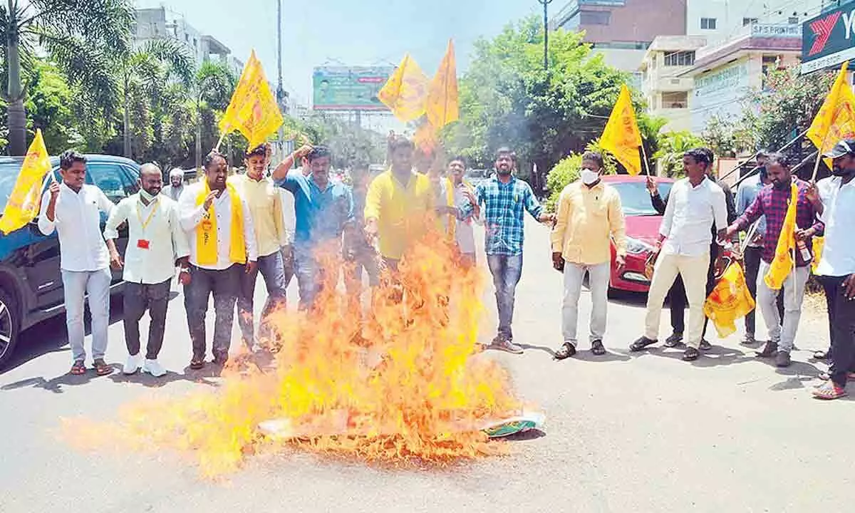 AP TNSF leaders burning an effigy of Chief Minister YS Jagan Mohan Reddy in Visakhapatnam